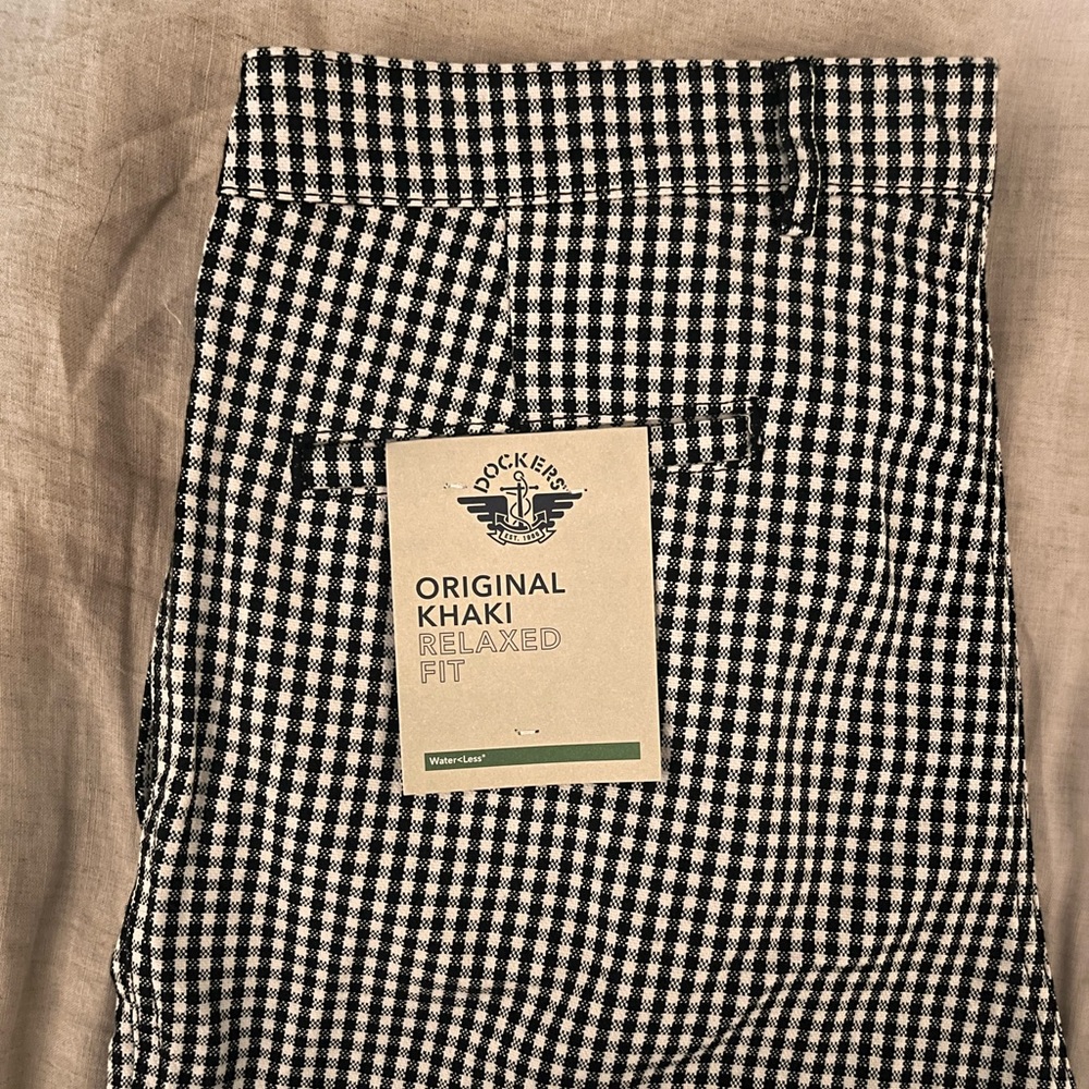 Checkered, black and white, trousers.